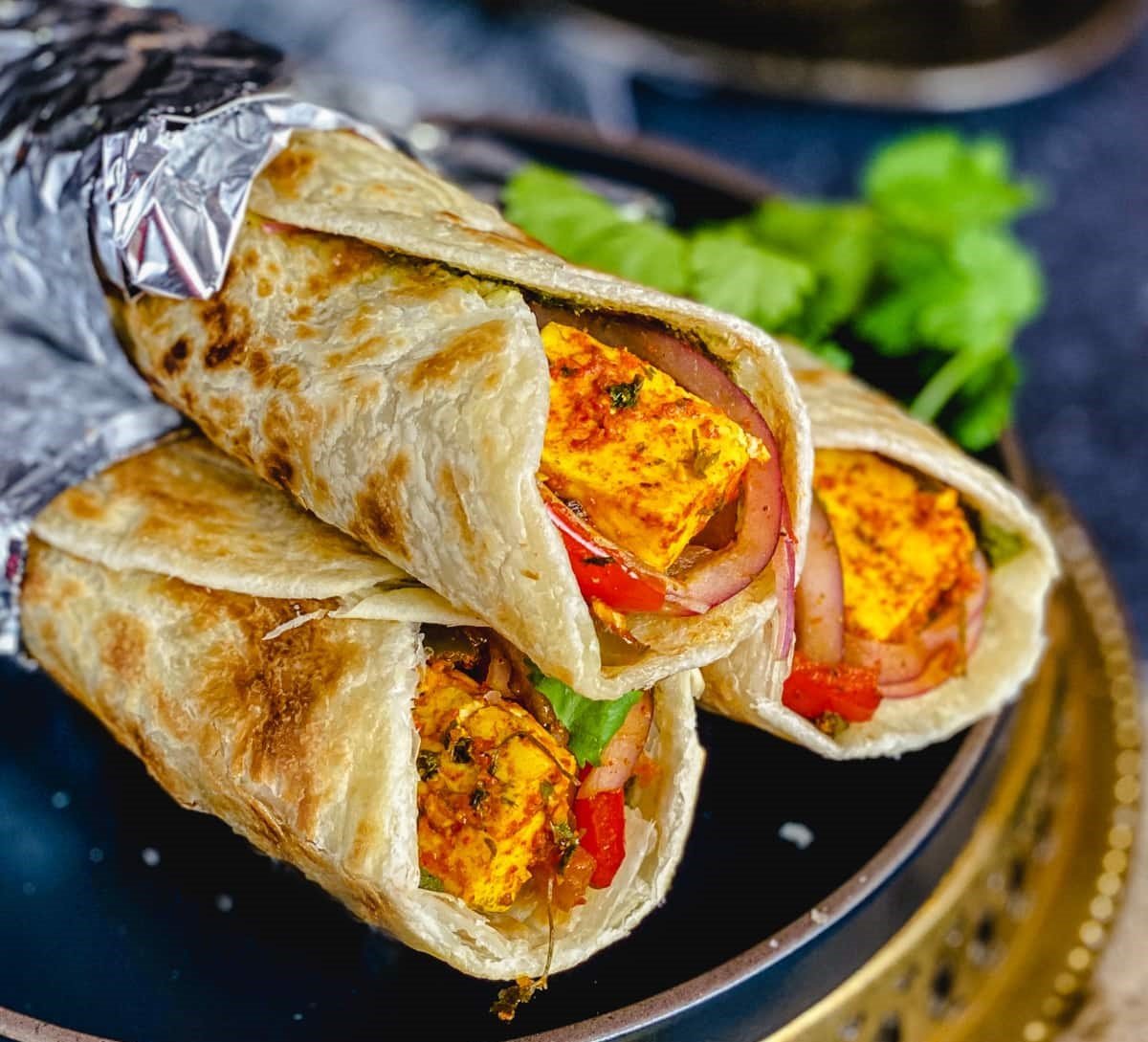 paneer kathi roll served in a plate